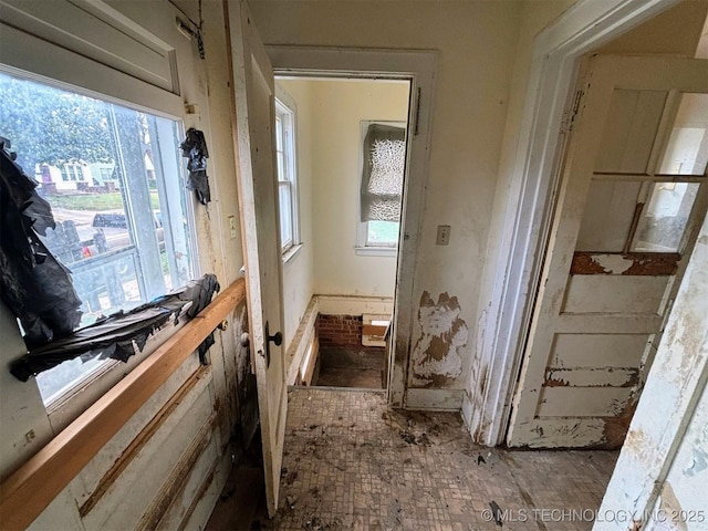 interior space featuring brick floor