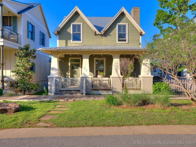 55 Boardwalk, Carlton Landing, OK 74432 - view of front of property with a porch, a chimney, metal roof, and a standing seam roof