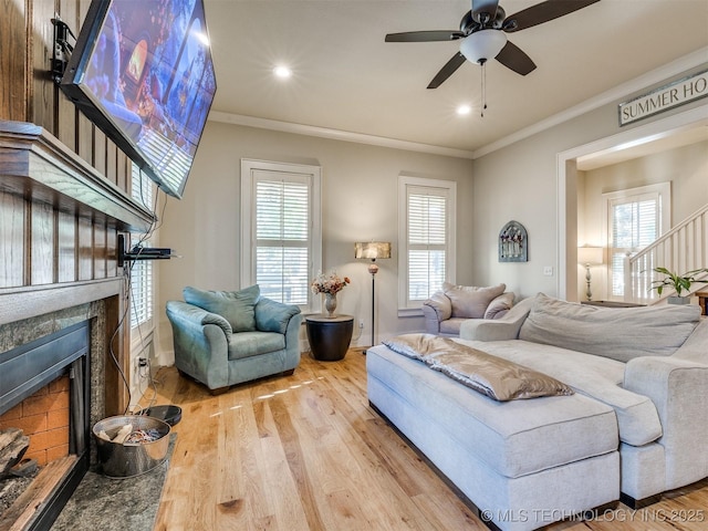 55 Boardwalk, Carlton Landing, OK 74432 - living area featuring a high end fireplace, wood finished floors, ornamental molding, a ceiling fan, and recessed lighting