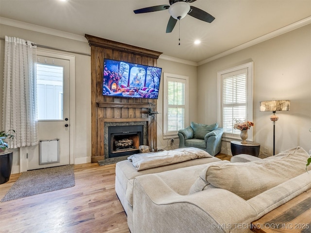 55 Boardwalk, Carlton Landing, OK 74432 - living room with ornamental molding, light wood-style flooring, a fireplace, ceiling fan, and recessed lighting