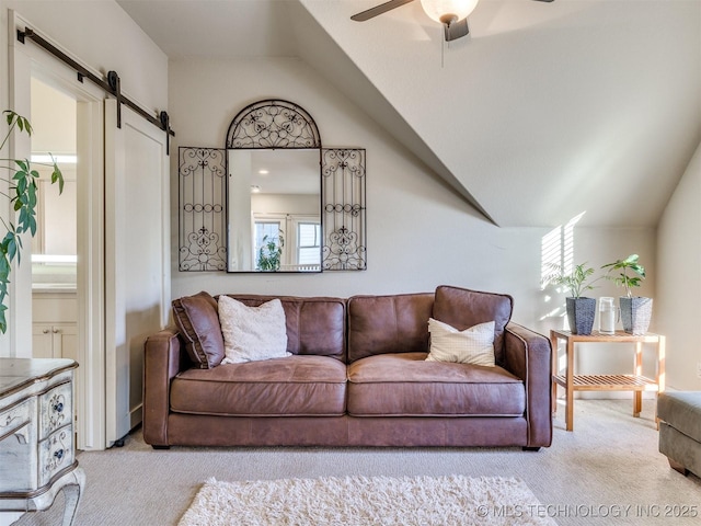 55 Boardwalk, Carlton Landing, OK 74432 - living area featuring carpet, vaulted ceiling, a barn door, and a ceiling fan