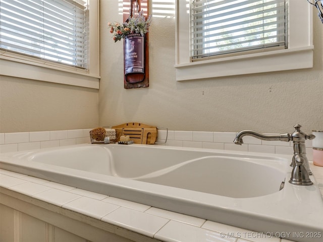 55 Boardwalk, Carlton Landing, OK 74432 - bathroom with a bath and a textured wall
