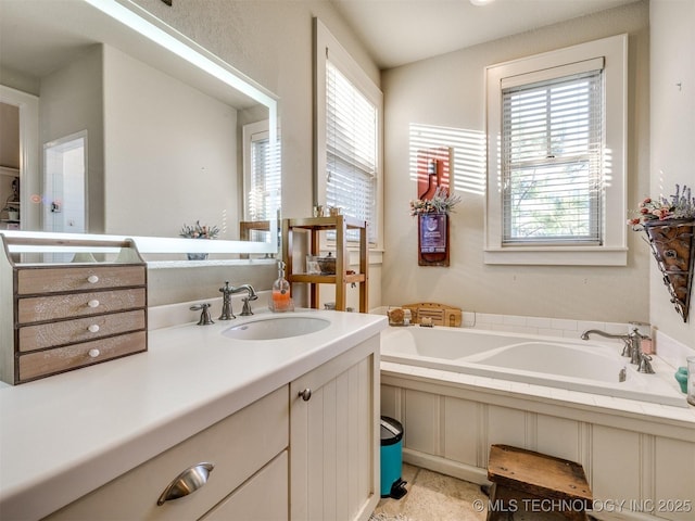 55 Boardwalk, Carlton Landing, OK 74432 - bathroom featuring plenty of natural light, vanity, and a garden tub