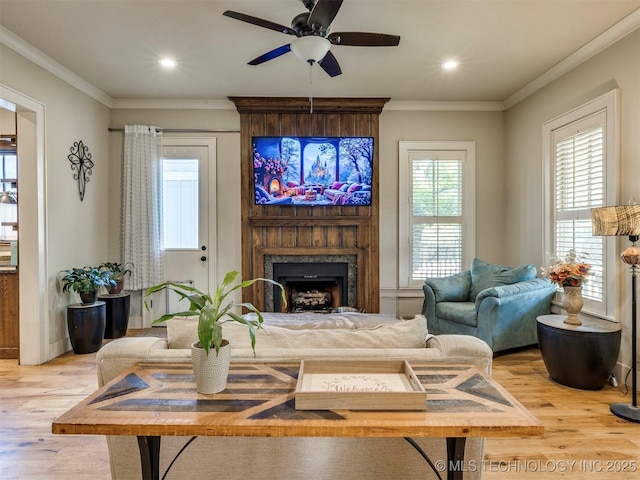 55 Boardwalk, Carlton Landing, OK 74432 - living room featuring light wood-style flooring, a ceiling fan, a fireplace, recessed lighting, and ornamental molding