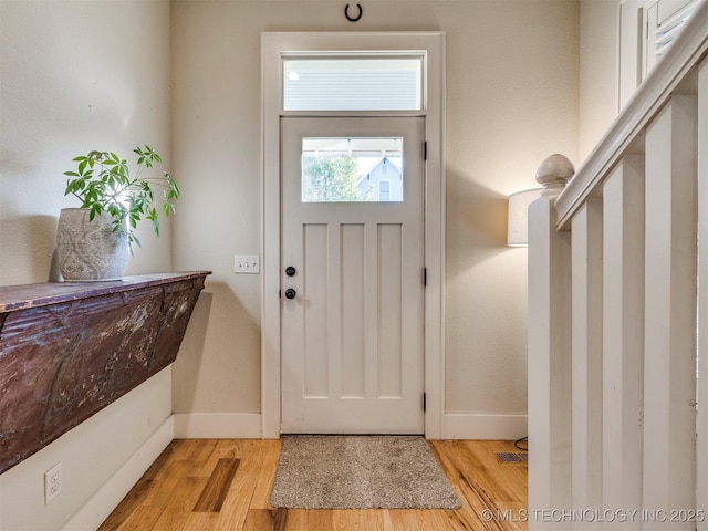 55 Boardwalk, Carlton Landing, OK 74432 - foyer entrance featuring baseboards and light wood-style flooring