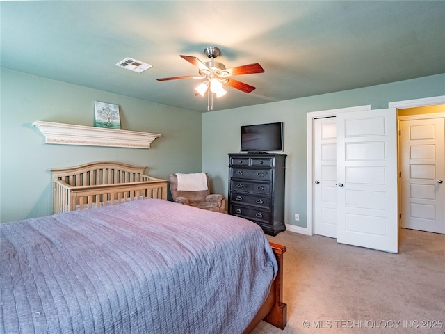 509 Dove Dr, Mcalester, OK 74501 - bedroom with baseboards, a ceiling fan, carpet flooring, and visible vents