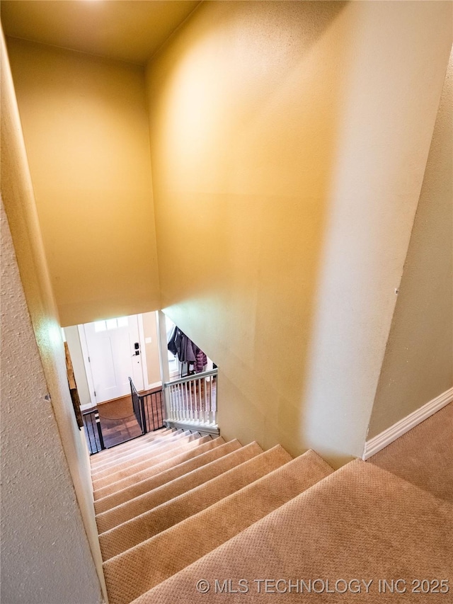 509 Dove Dr, Mcalester, OK 74501 - staircase with baseboards and carpet