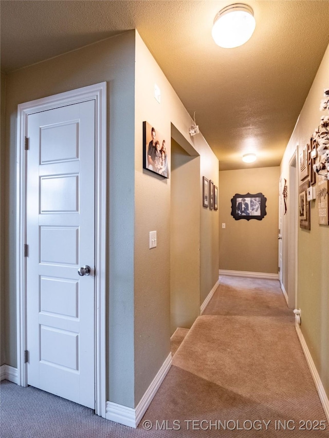 509 Dove Dr, Mcalester, OK 74501 - hall with baseboards and carpet