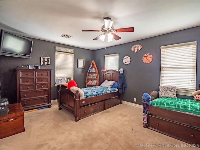 509 Dove Dr, Mcalester, OK 74501 - bedroom featuring baseboards, ceiling fan, carpet flooring, and visible vents