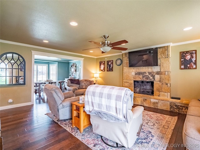 509 Dove Dr, Mcalester, OK 74501 - living room with hardwood / wood-style floors, baseboards, a stone fireplace, ceiling fan, and recessed lighting