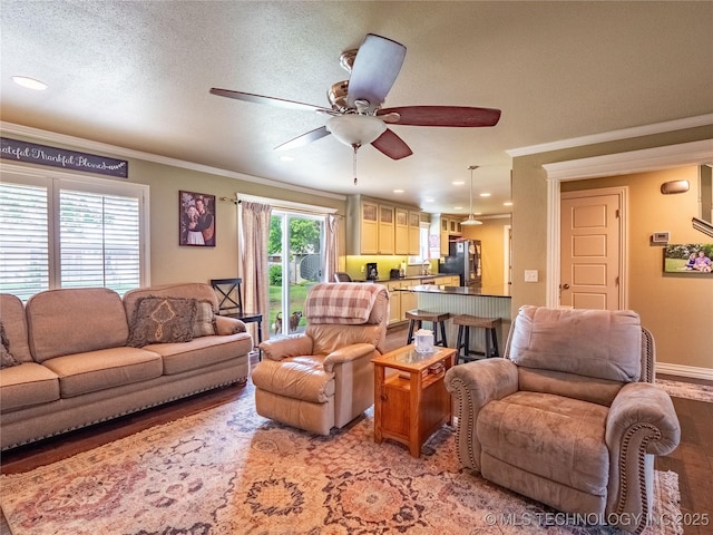 509 Dove Dr, Mcalester, OK 74501 - living room with crown molding, recessed lighting, ceiling fan, and light wood-type flooring