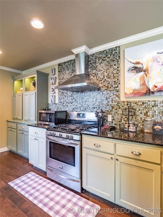 509 Dove Dr, Mcalester, OK 74501 - kitchen featuring crown molding, wall chimney range hood, tasteful backsplash, dark wood finished floors, and stainless steel appliances