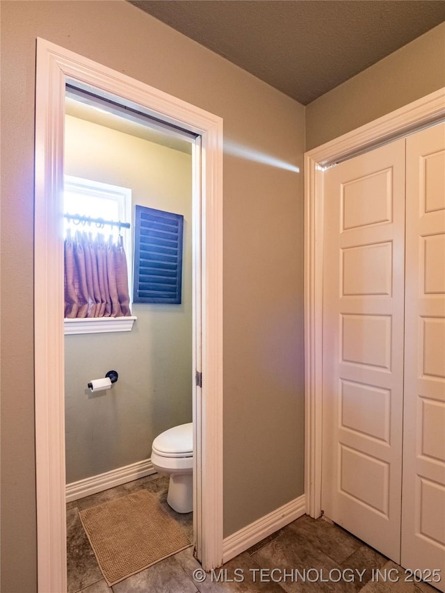 509 Dove Dr, Mcalester, OK 74501 - bathroom with toilet and baseboards