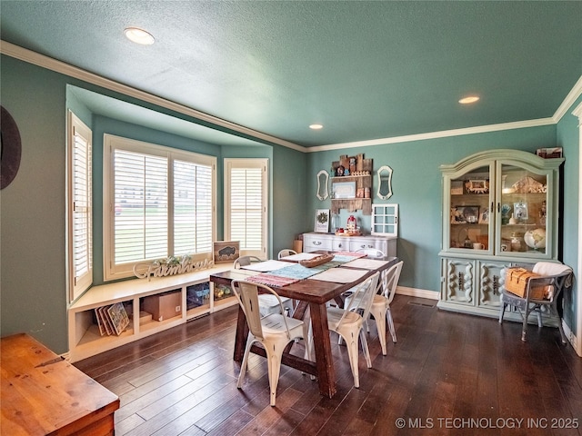 509 Dove Dr, Mcalester, OK 74501 - dining area with a textured ceiling, recessed lighting, baseboards, dark wood-type flooring, and ornamental molding