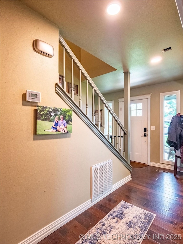 509 Dove Dr, Mcalester, OK 74501 - foyer entrance featuring baseboards, wood-type flooring, and visible vents