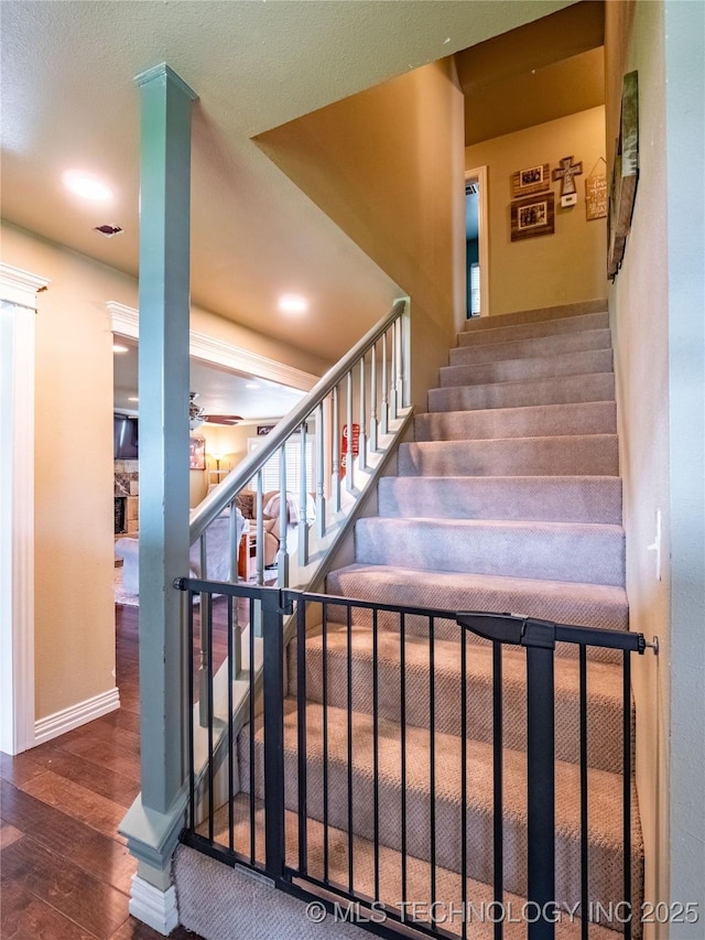 509 Dove Dr, Mcalester, OK 74501 - stairs with recessed lighting, baseboards, ceiling fan, and hardwood / wood-style flooring