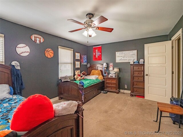 509 Dove Dr, Mcalester, OK 74501 - bedroom featuring baseboards, a ceiling fan, and carpet flooring