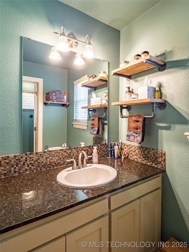 509 Dove Dr, Mcalester, OK 74501 - bathroom with vanity and a textured wall