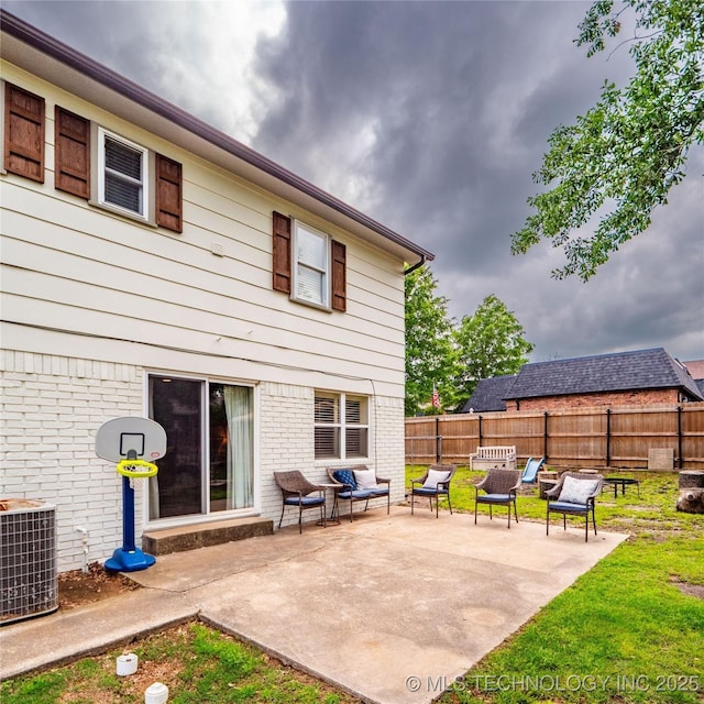 509 Dove Dr, Mcalester, OK 74501 - rear view of property featuring brick siding, a patio area, fence, and cooling unit