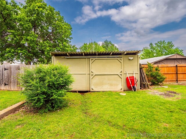 509 Dove Dr, Mcalester, OK 74501 - view of shed with a fenced backyard