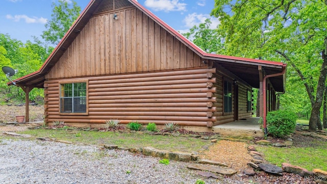 view of home's exterior with log siding