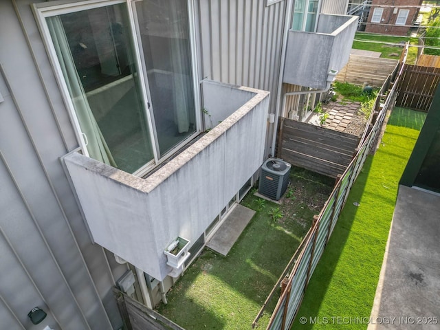 1428 S Quincy Ave Unit B, Tulsa, OK 74120 - view of side of home with central air condition unit and fence