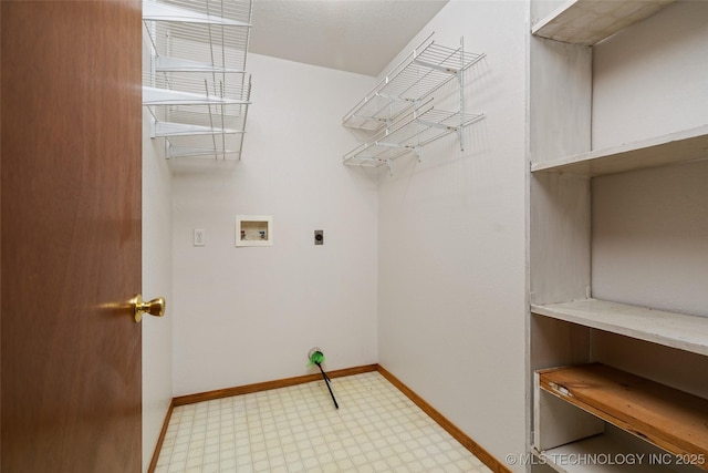 washroom with hookup for a washing machine, electric dryer hookup, light floors, baseboards, and laundry area