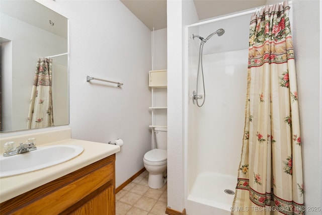 bathroom featuring a shower stall, toilet, and vanity