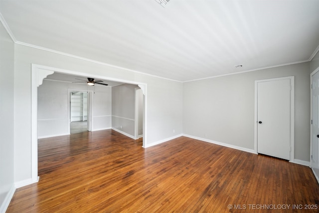 unfurnished room with baseboards, ceiling fan, and wood-type flooring