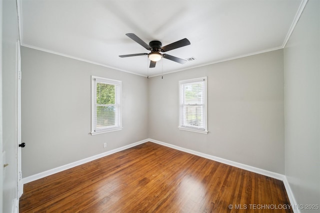 unfurnished room with baseboards, visible vents, and plenty of natural light