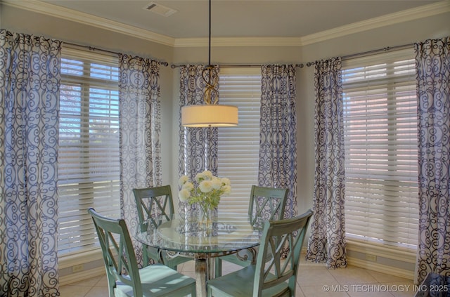 8160 S 270th E Ave, Broken Arrow, OK 74014 - tiled dining area featuring ornamental molding and baseboards
