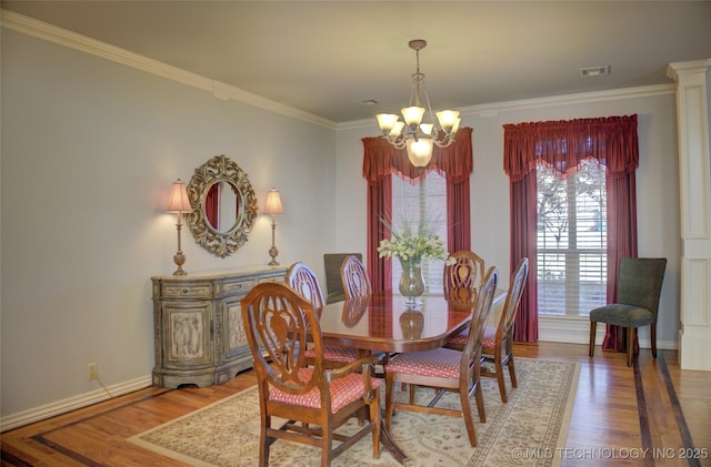 8160 S 270th E Ave, Broken Arrow, OK 74014 - dining area with a chandelier, ornamental molding, wood finished floors, and baseboards
