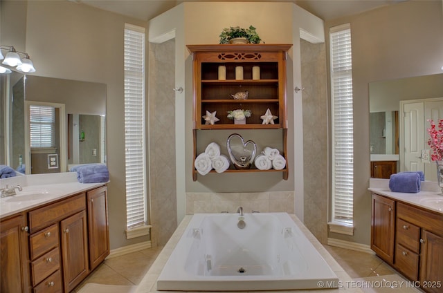 8160 S 270th E Ave, Broken Arrow, OK 74014 - full bathroom with two vanities, a whirlpool tub, baseboards, and tile patterned floors
