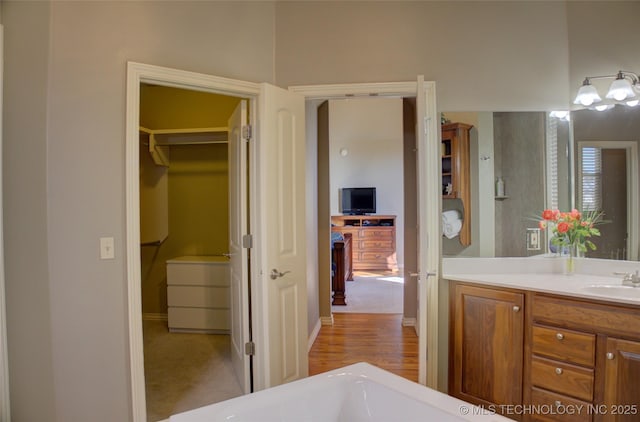 8160 S 270th E Ave, Broken Arrow, OK 74014 - full bath featuring vanity, a walk in closet, and baseboards