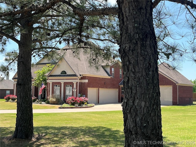 8160 S 270th E Ave, Broken Arrow, OK 74014 - view of front facade with brick siding, an attached garage, a front yard, and driveway