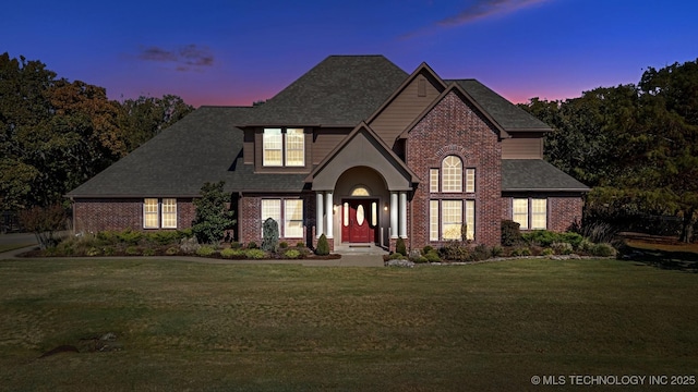19434 S Quail Run Ct, Claremore, OK 74017 - view of front facade with brick siding, a front yard, and a shingled roof