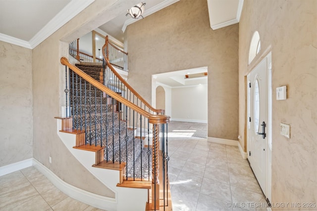 19434 S Quail Run Ct, Claremore, OK 74017 - tiled entryway featuring ornamental molding, a high ceiling, stairway, and baseboards