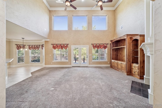 19434 S Quail Run Ct, Claremore, OK 74017 - unfurnished living room with ceiling fan, ornamental molding, a high ceiling, carpet floors, and baseboards