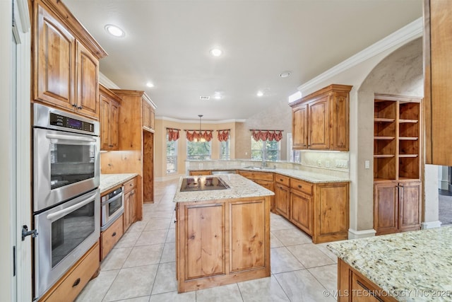 19434 S Quail Run Ct, Claremore, OK 74017 - kitchen with stainless steel double oven, a kitchen island, decorative backsplash, crown molding, and black electric cooktop