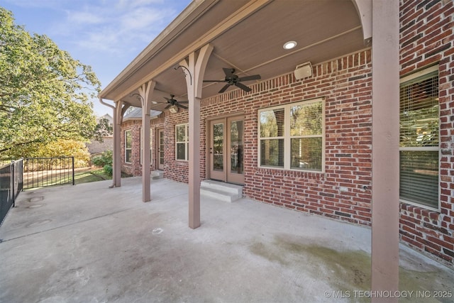 19434 S Quail Run Ct, Claremore, OK 74017 - view of patio featuring a ceiling fan, fence, and french doors