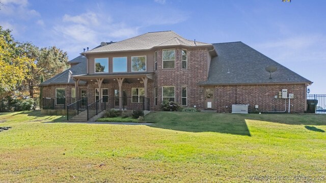 19434 S Quail Run Ct, Claremore, OK 74017 - rear view of property with brick siding and a yard