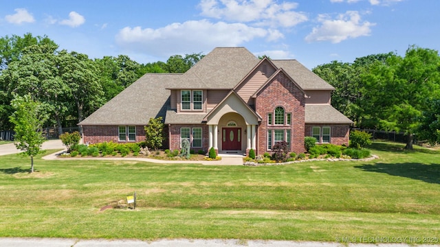 19434 S Quail Run Ct, Claremore, OK 74017 - traditional home featuring brick siding and a shingled roof