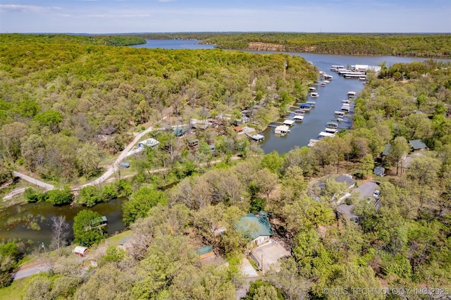 5068 County Road 370, Eucha, OK 74342 - aerial view of property and surrounding area with a forest and a nearby body of water