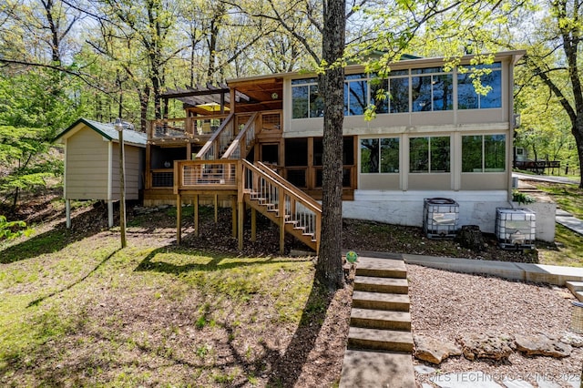 5068 County Road 370, Eucha, OK 74342 - back of house with stairs, a sunroom, and a wooden deck