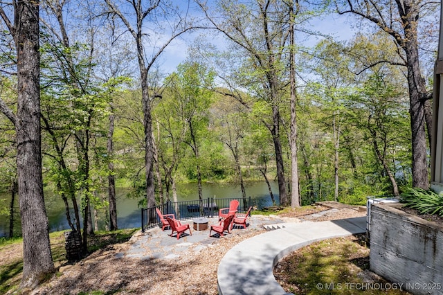 5068 County Road 370, Eucha, OK 74342 - view of community with a fire pit and a wooded view