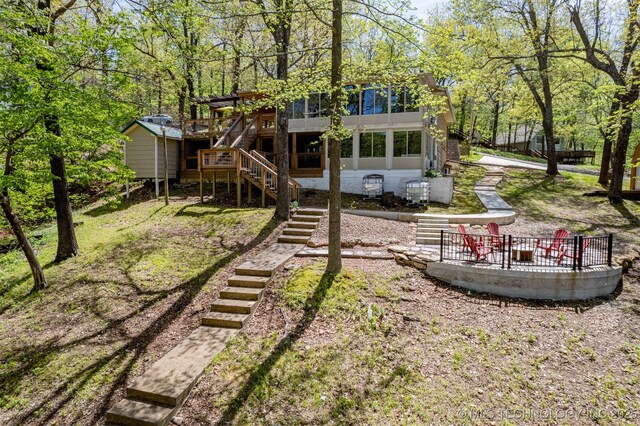 5068 County Road 370, Eucha, OK 74342 - view of yard with stairway and a wooden deck