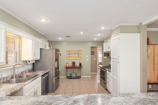 5068 County Road 370, Eucha, OK 74342 - kitchen featuring baseboards, light tile patterned floors, stainless steel appliances, a sink, and white cabinetry