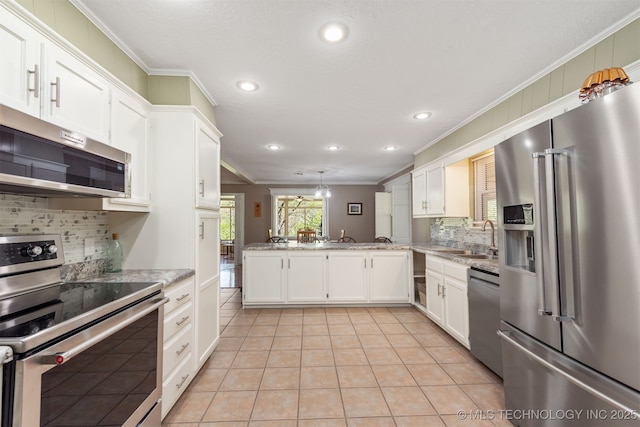 5068 County Road 370, Eucha, OK 74342 - kitchen featuring recessed lighting, stainless steel appliances, ornamental molding, backsplash, and a sink