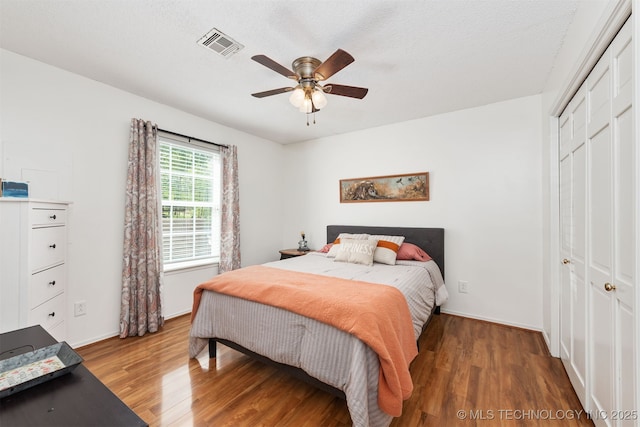 5068 County Road 370, Eucha, OK 74342 - bedroom with light wood-style flooring, a closet, ceiling fan, baseboards, and visible vents