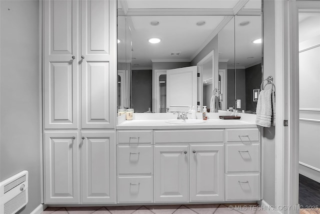 4829 S Zunis Ave, Tulsa, OK 74105 - full bathroom featuring vanity, heating unit, crown molding, visible vents, and baseboards